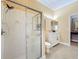 Bathroom featuring a glass shower enclosure, a white vanity, and neutral tile flooring at 1473 Lakemist Ln, Clermont, FL 34711