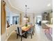 Inviting dining room with natural lighting, views, and stylish furnishings at 1473 Lakemist Ln, Clermont, FL 34711