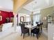 Elegant dining room features a chandelier, decorative curtains, and access to the formal living area at 1473 Lakemist Ln, Clermont, FL 34711