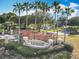 Community entrance featuring lush landscaping, a decorative fountain, and the 'Legends' community sign at 1473 Lakemist Ln, Clermont, FL 34711
