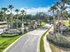 Community entrance featuring lush landscaping, a decorative fountain, and the 'Legends' community sign at 1473 Lakemist Ln, Clermont, FL 34711