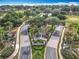 Community entrance featuring lush landscaping, a decorative fountain, and the 'Legends' community sign at 1473 Lakemist Ln, Clermont, FL 34711
