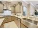 Stylish kitchen with a stainless steel sink, granite countertops, and designer backsplash at 1473 Lakemist Ln, Clermont, FL 34711
