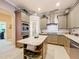 Well-equipped kitchen with an island, stainless appliances, and a convenient pantry at 1473 Lakemist Ln, Clermont, FL 34711