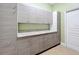 Laundry room with counterspace, cabinets, and a door to another part of the house at 1473 Lakemist Ln, Clermont, FL 34711