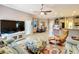 Spacious living room with comfortable seating and an open layout at 1473 Lakemist Ln, Clermont, FL 34711