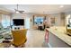 Open concept living room that includes a dining area and access to a large kitchen at 1473 Lakemist Ln, Clermont, FL 34711