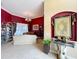 Formal living room boasts a decorative tapestry, tile floors, and abundant natural light at 1473 Lakemist Ln, Clermont, FL 34711