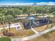 Aerial view of the community playground with picnic tables and mature landscaping at 1473 Lakemist Ln, Clermont, FL 34711