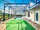 Enclosed pool with brick border and manicured green offers private relaxation and recreation at 1473 Lakemist Ln, Clermont, FL 34711