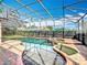 Enclosed pool features a hot tub, manicured green spaces, and relaxing atmosphere at 1473 Lakemist Ln, Clermont, FL 34711