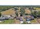 Sprawling country property featuring a charming home, fenced land, mature trees, and outbuildings at 15117 Se 94Th Ter, Summerfield, FL 34491