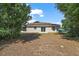 Large backyard with a concrete patio, perfect for relaxing and entertaining outdoors at 15117 Se 94Th Ter, Summerfield, FL 34491