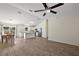 Open-concept kitchen featuring a central island, white cabinets, and stainless steel appliances at 15117 Se 94Th Ter, Summerfield, FL 34491