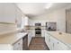 Updated kitchen with stainless steel appliances, bright countertops and a kitchen island for extra space at 15117 Se 94Th Ter, Summerfield, FL 34491
