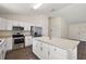 Open kitchen featuring stainless steel appliances, an island with storage, and lots of cabinet space at 15117 Se 94Th Ter, Summerfield, FL 34491