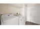 Functional laundry room with modern washer and dryer units and ample storage space at 15117 Se 94Th Ter, Summerfield, FL 34491