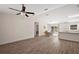 Bright, open-concept living space with modern vinyl flooring and a view to the dining area at 15117 Se 94Th Ter, Summerfield, FL 34491