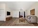 Cozy living room with a comfortable sofa, area rug, and a television at 15117 Se 94Th Ter, Summerfield, FL 34491