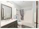 Updated bathroom with a modern vanity, and shower-tub combination at 1622 Navidad St, The Villages, FL 32162