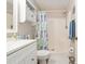 A well-maintained bathroom with a tub/shower combo, updated vanity and a linen closet at 1622 Navidad St, The Villages, FL 32162