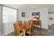 Traditional dining room with a wooden table set and natural light from a window at 1622 Navidad St, The Villages, FL 32162