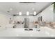 Beautiful kitchen with white cabinets, quartz countertops, and stainless steel appliances at 1622 Navidad St, The Villages, FL 32162