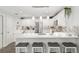 Stylish kitchen featuring a large island with seating and pendant lighting at 1622 Navidad St, The Villages, FL 32162