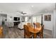 Open-concept space showcasing the dining area flowing into the comfortable living room at 1622 Navidad St, The Villages, FL 32162
