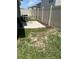 Fenced backyard with a patio area at 1721 Nebraska Loop, Sumterville, FL 33585