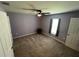Bedroom with a ceiling fan and window providing natural light at 1721 Nebraska Loop, Sumterville, FL 33585