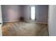 Comfortable bedroom featuring carpeted floors, a window, and a ceiling fan at 1721 Nebraska Loop, Sumterville, FL 33585