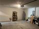Spacious garage with ample storage space and a concrete floor at 1721 Nebraska Loop, Sumterville, FL 33585