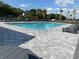 Community pool with lounge chairs offers a relaxing outdoor experience at 1721 Nebraska Loop, Sumterville, FL 33585