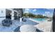 Community clubhouse and pool area features plenty of seating and tables for outdoor enjoyment at 1721 Nebraska Loop, Sumterville, FL 33585