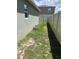 Narrow side yard at 1721 Nebraska Loop, Sumterville, FL 33585