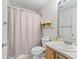 Bathroom with vanity, toilet, and shower with curtain at 17349 Se 76Th Flintlock Ter, The Villages, FL 32162