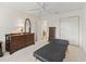 Bedroom with white carpet, dresser, and massage table at 17349 Se 76Th Flintlock Ter, The Villages, FL 32162