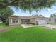 Beautiful single-story home with a well-maintained lawn and an attached two car garage in a neighborhood at 17349 Se 76Th Flintlock Ter, The Villages, FL 32162