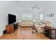 Cozy living room with plush seating, a large flat screen TV, and neutral decor at 17349 Se 76Th Flintlock Ter, The Villages, FL 32162