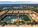 Panoramic aerial view of a residential community with ponds, fountains, and lush landscaping at 1795 Piedmont Pl, Lake Mary, FL 32746