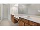 Bathroom with dual sinks, ample counter space, and a large mirror, plus a glass-enclosed shower at 1795 Piedmont Pl, Lake Mary, FL 32746
