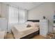 Well-lit bedroom with a plush bed, soft linens, and tasteful decor at 1795 Piedmont Pl, Lake Mary, FL 32746