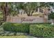 Elegant entrance to Grande Oaks at Heathrow with lush landscaping and upscale building in the background at 1795 Piedmont Pl, Lake Mary, FL 32746
