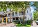 Charming townhome with gray exterior, white balconies, and lush landscaping in a desirable community at 1795 Piedmont Pl, Lake Mary, FL 32746