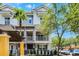 Beautiful townhome featuring a light gray exterior, private balconies, and well-maintained landscaping at 1795 Piedmont Pl, Lake Mary, FL 32746