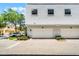 Townhome featuring a two car garage, light gray exterior paint and a landscaped corner at 1795 Piedmont Pl, Lake Mary, FL 32746