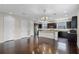 Open-concept kitchen featuring stainless steel appliances, granite countertops, and dark cabinetry at 1795 Piedmont Pl, Lake Mary, FL 32746