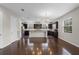 Open-concept kitchen featuring stainless steel appliances, granite countertops, and dark cabinetry at 1795 Piedmont Pl, Lake Mary, FL 32746