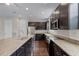 Modern kitchen featuring stainless steel appliances, granite countertops, and dark wood cabinets at 1795 Piedmont Pl, Lake Mary, FL 32746